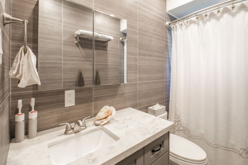 simple small bathroom reno having a shower curtain