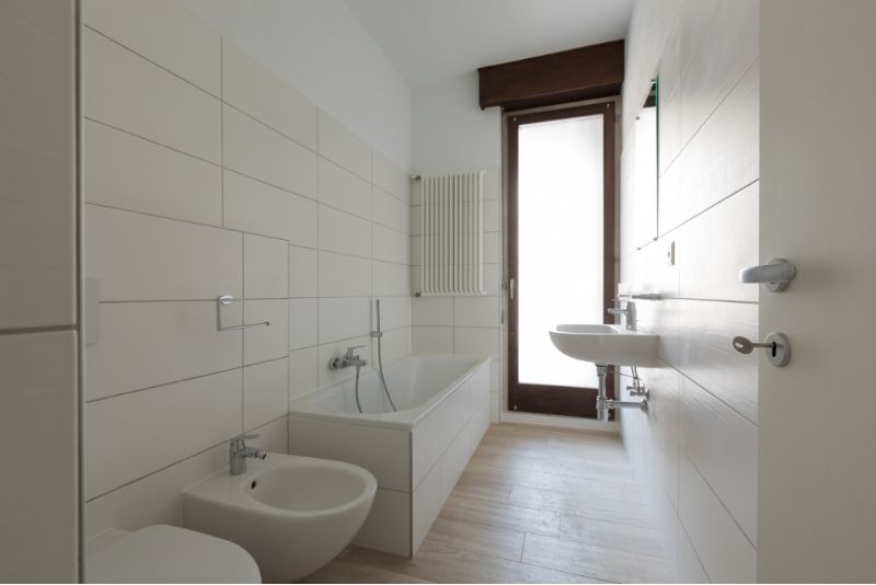 bathroom upgrades picture having a all white wall sink, bathroom tub