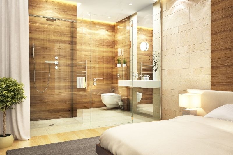 ensuite bathroom with crystal door and brown coloured wall